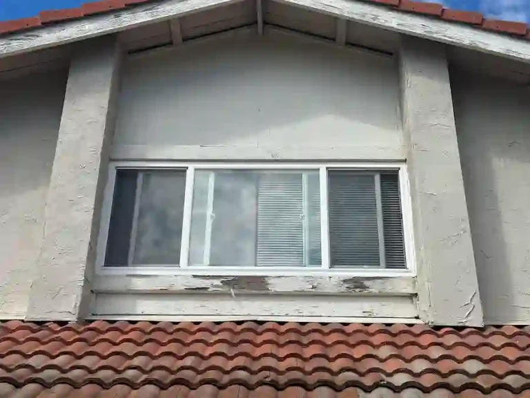 Damaged fascia boards and cracked concrete tiles on a Milpitas home before roofline restoration.
