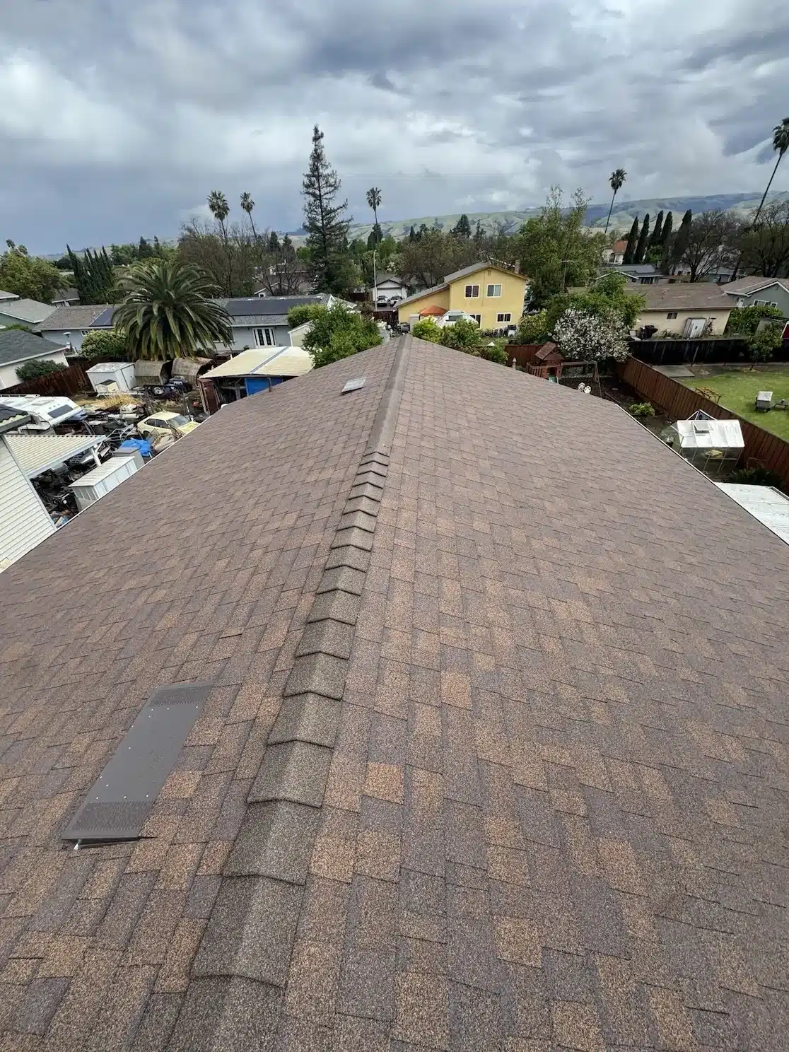 Ridge line of the completed Forest Brown shingle reroof at 33940 Macmillan Way, Fremont CA