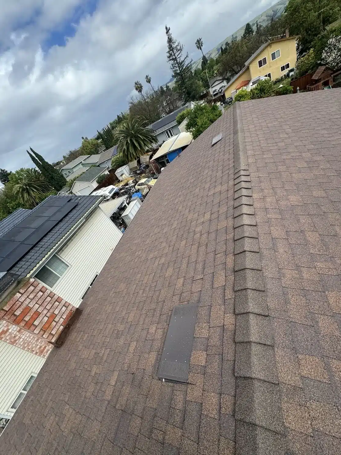 New attic vent and Forest Brown shingles installed during reshingle at 33940 Macmillan Way, Fremont CA