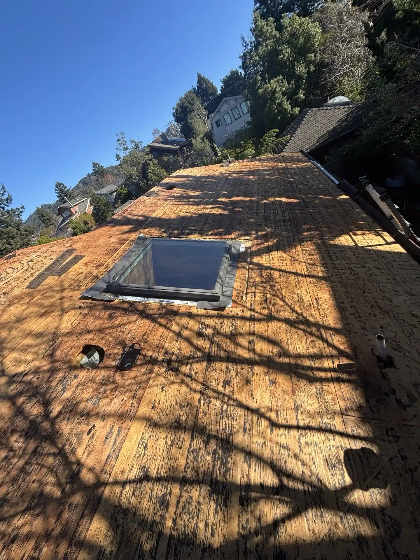 Shingle reroof installation in progress after solar removal at 6430 Colby Street, Oakland CA