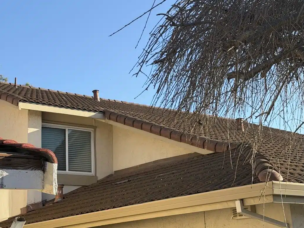 Original concrete tiles relaid over new underlayment after roof leak repair in Fremont CA