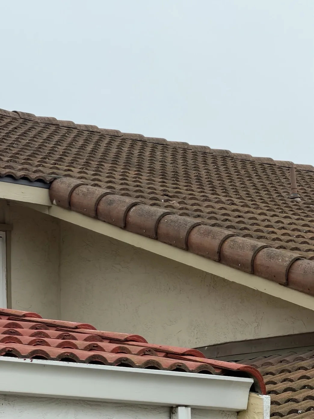Aging 24-year-old concrete tile roof at the rake edge before leak repair at a Fremont CA home