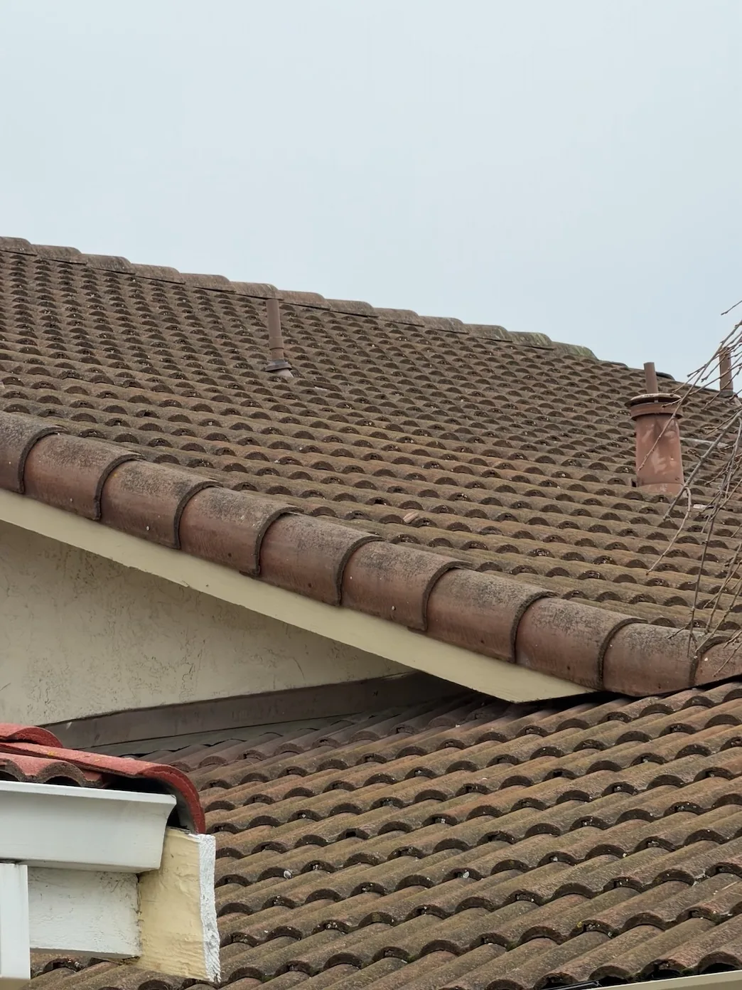 24-year-old concrete tile roof over the garage before the localized leak repair in Fremont CA