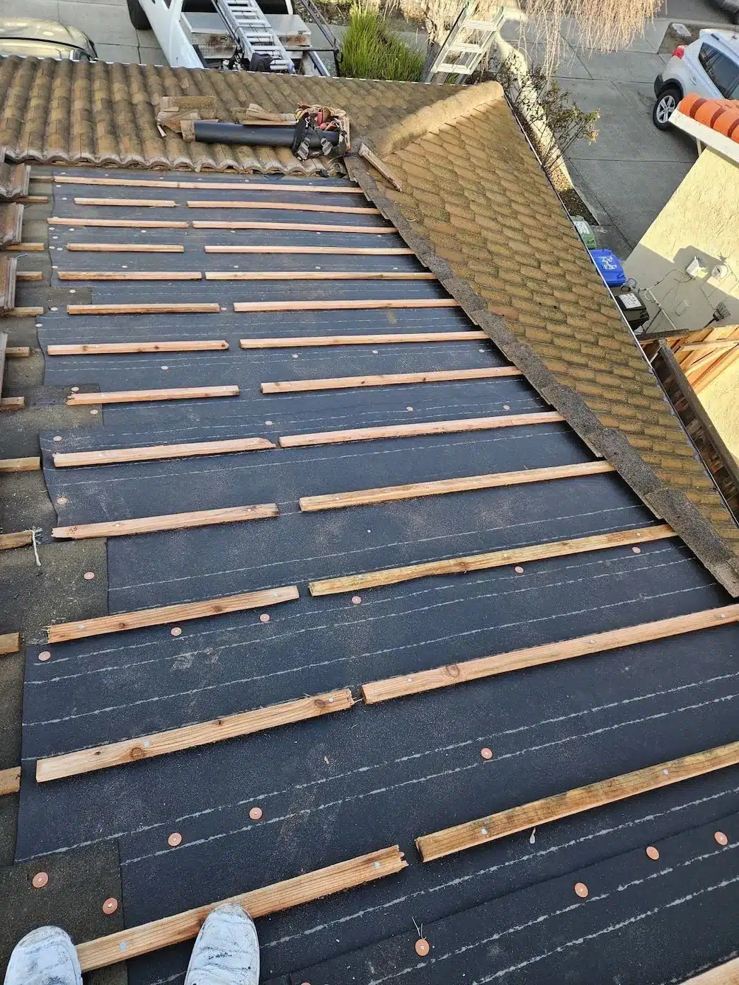 New underlayment and battens across the garage roof section during concrete tile roof repair in Fremont CA