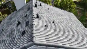 New Foster City concrete tile roof in a blended charcoal-gray finish after a full re-roof