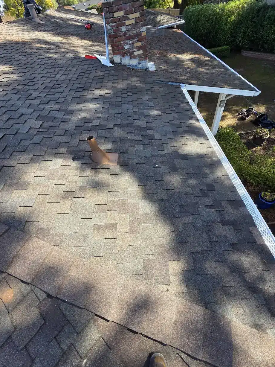 Shingle roof with eave and fascia line after repair in Los Altos