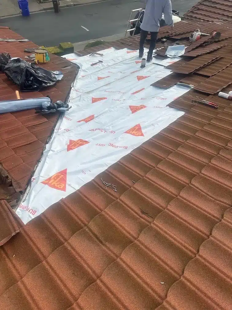 New Sika synthetic underlayment installed on the repair section during tile roof leak repair in Richmond