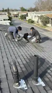 New pipe boot flashings and the new skylight being set during a skylight replacement on Tasman Drive in Sunnyvale, CA