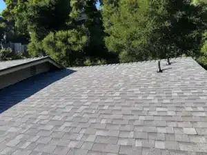 New architectural asphalt shingle roof after full replacement, ridge to eave, in Oakland