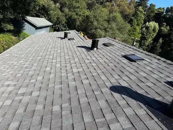 Finished shingle roof with new pipe boots, vents and skylight flashing in the Oakland Hills