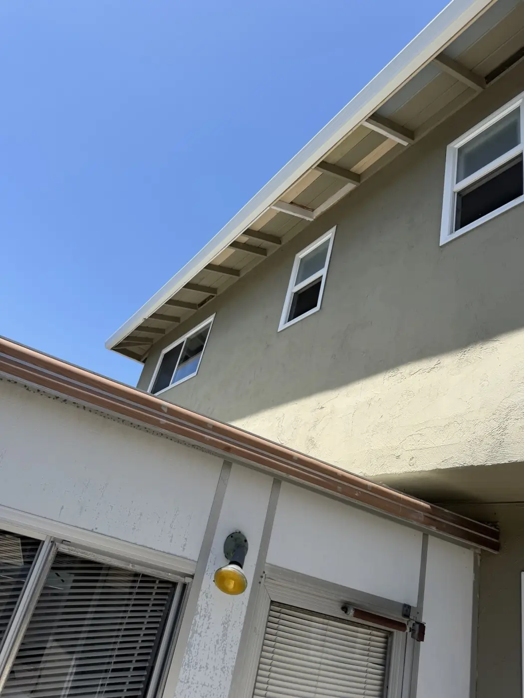 New fascia board and seamless gutter on the two-story elevation in Milpitas, CA