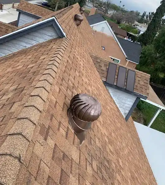 New turbine attic vents installed on a shingle roof in Rialto, CA