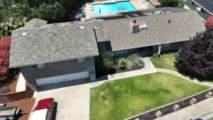 Aerial view of a Pleasanton, CA ranch home after a full architectural shingle roof replacement by Lifetime Roofing and Renovation