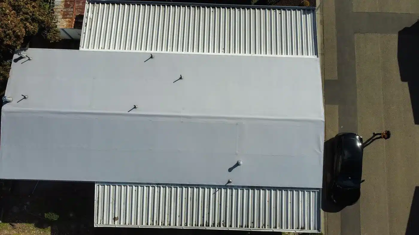Top-down aerial of the completed manufactured-home roof-over on Berkeley Road in Hayward