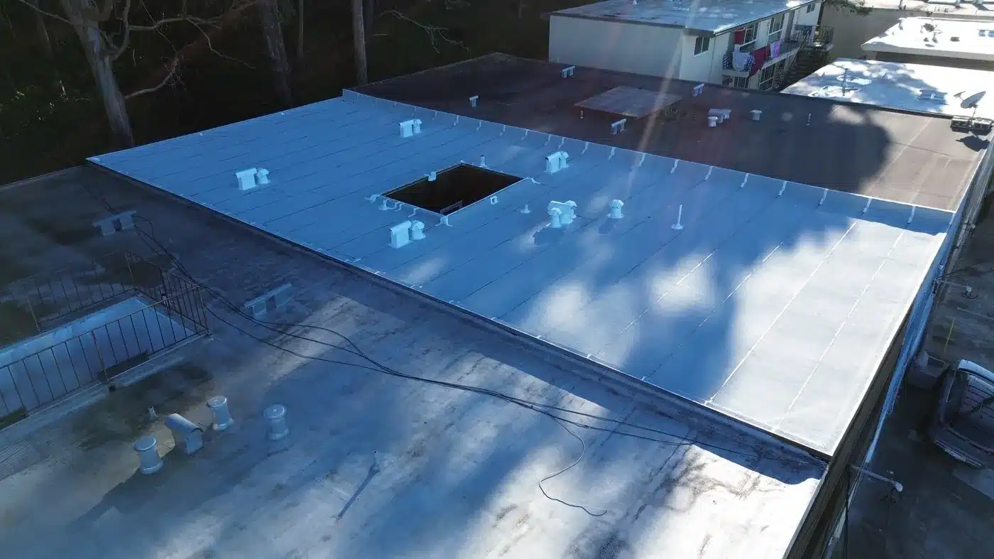 Aerial view of the new light-colored flat roof on Templeton Avenue in Daly City