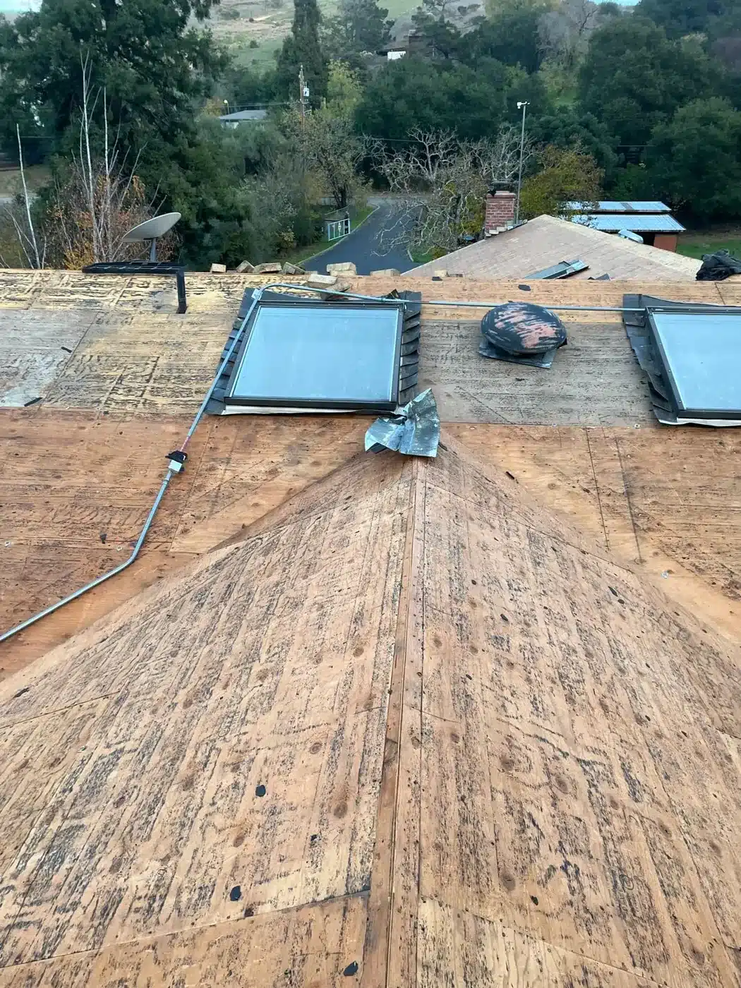 New half-inch OSB deck overlay installed over the old roof deck in Castro Valley