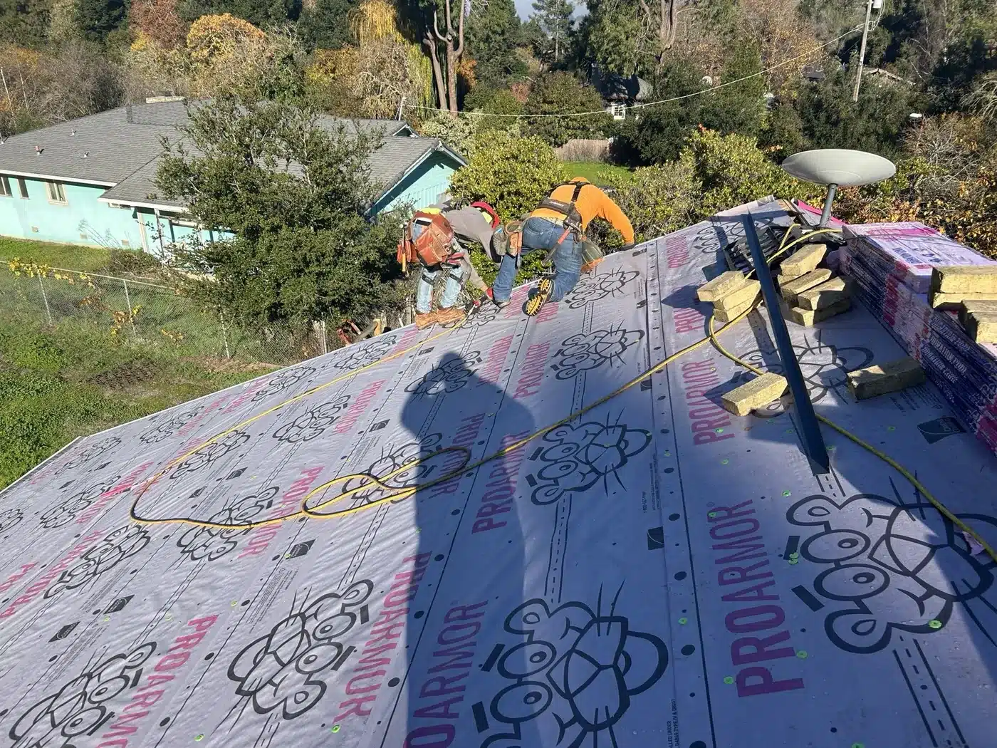 Owens Corning ProArmor synthetic underlayment being installed on the Castro Valley roof