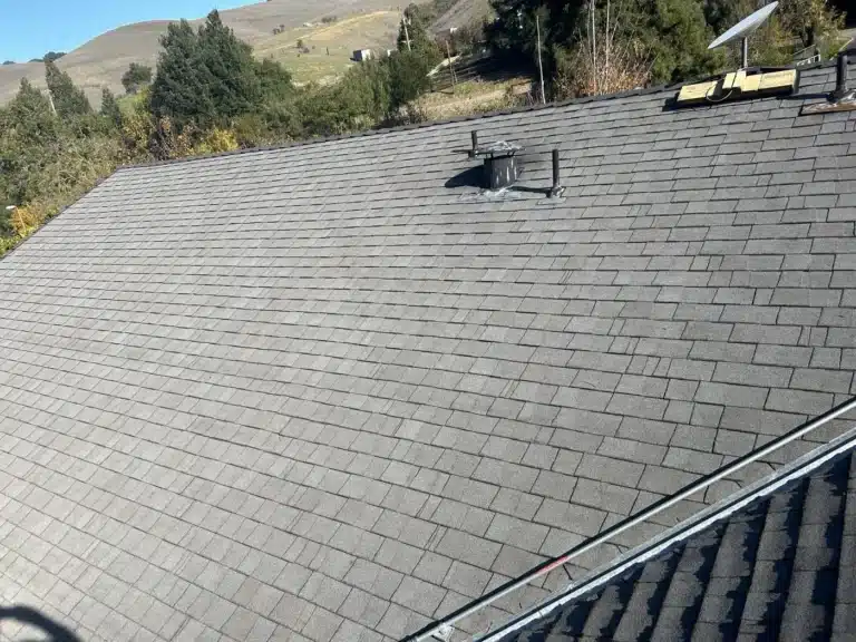 Finished Owens Corning Oyster Shell shingle roof on a Castro Valley ranch home with hills behind