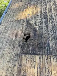 Rotted roof decking with a hole found during the Castro Valley roof inspection