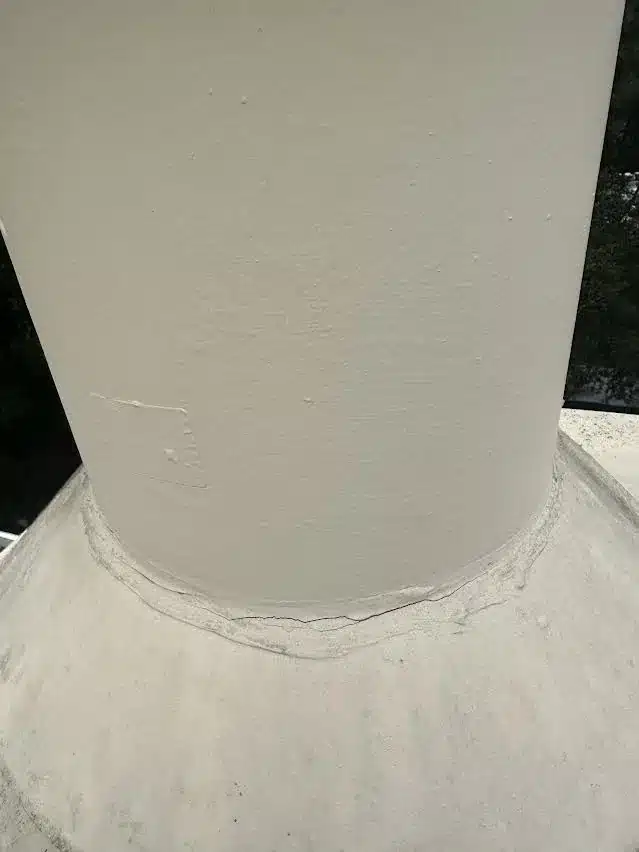 New sealed storm collar at the base of the flue after the chimney flashing repair on a Hayward roof