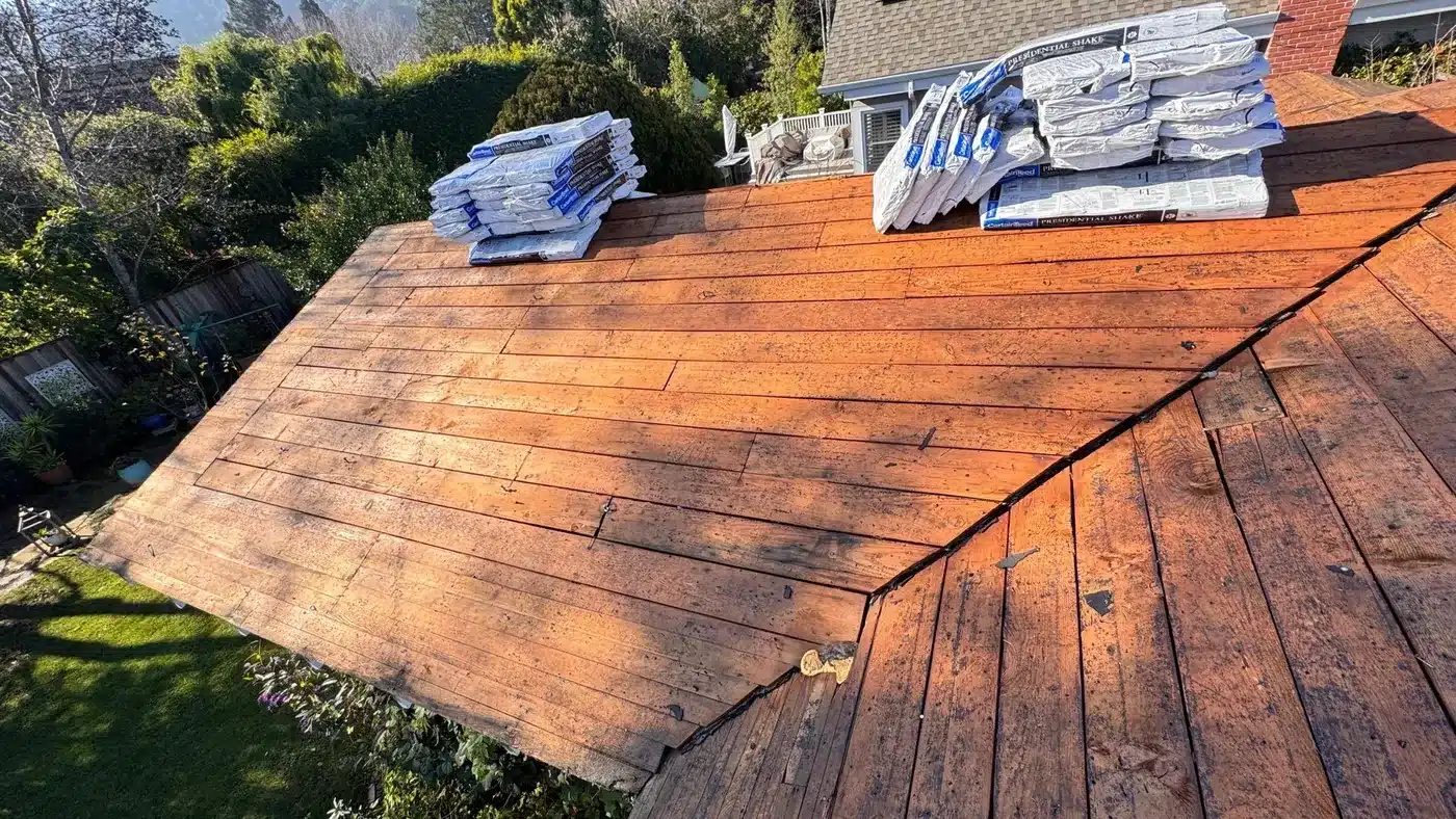 Shingle bundles loaded on the new plywood deck before installation in Corte Madera, CA