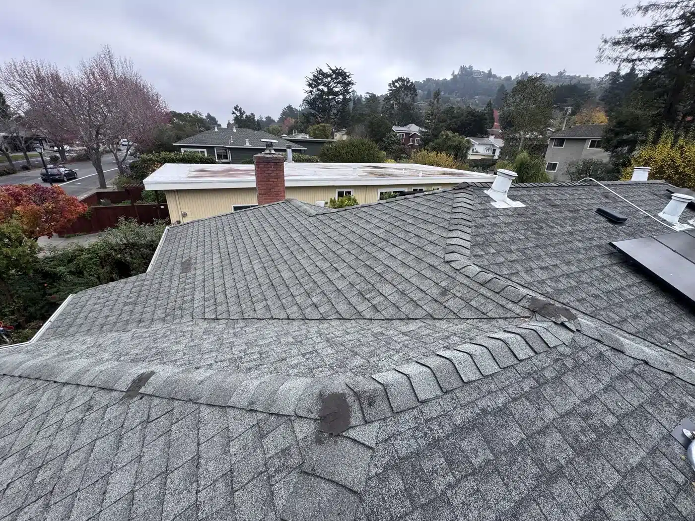 Worn asphalt shingle roof with staining and granule loss before replacement in Corte Madera, CA
