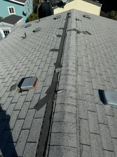 Cracked and slipped shingles before re-roofing in Soquel
