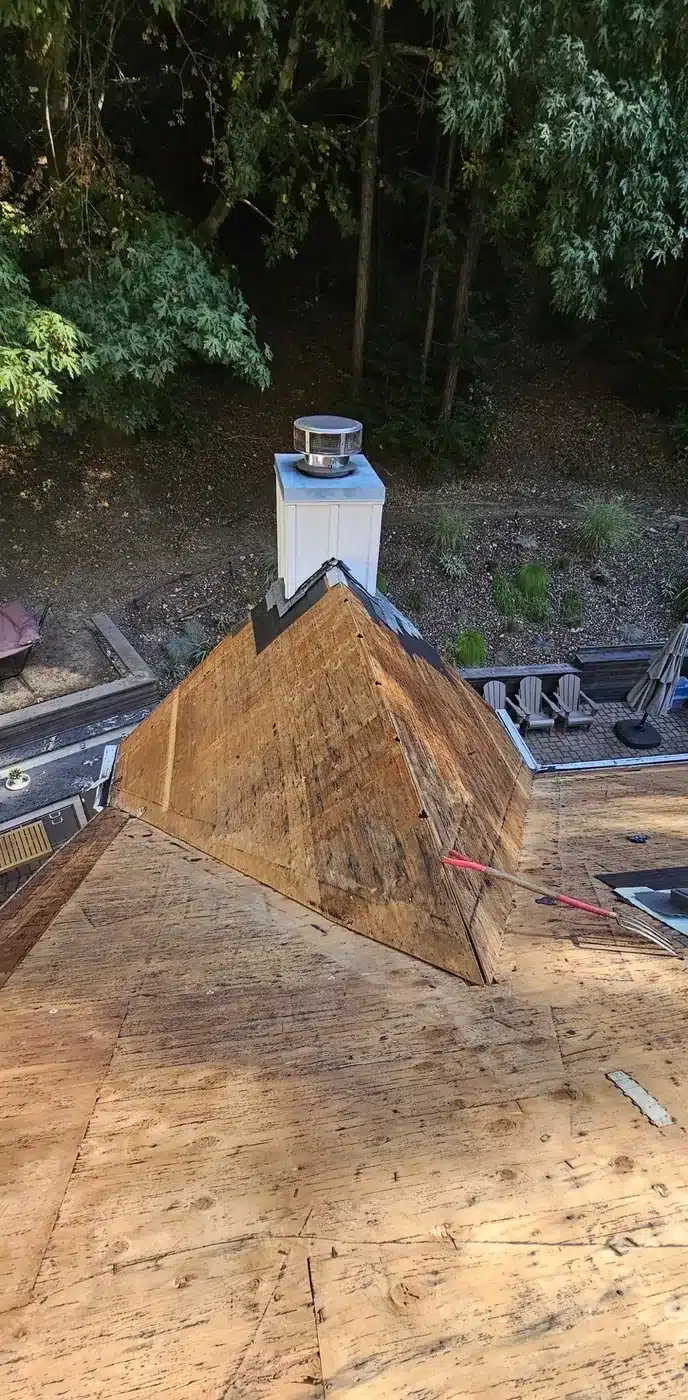 Steep roof torn off to the plywood deck during replacement in Felton, CA