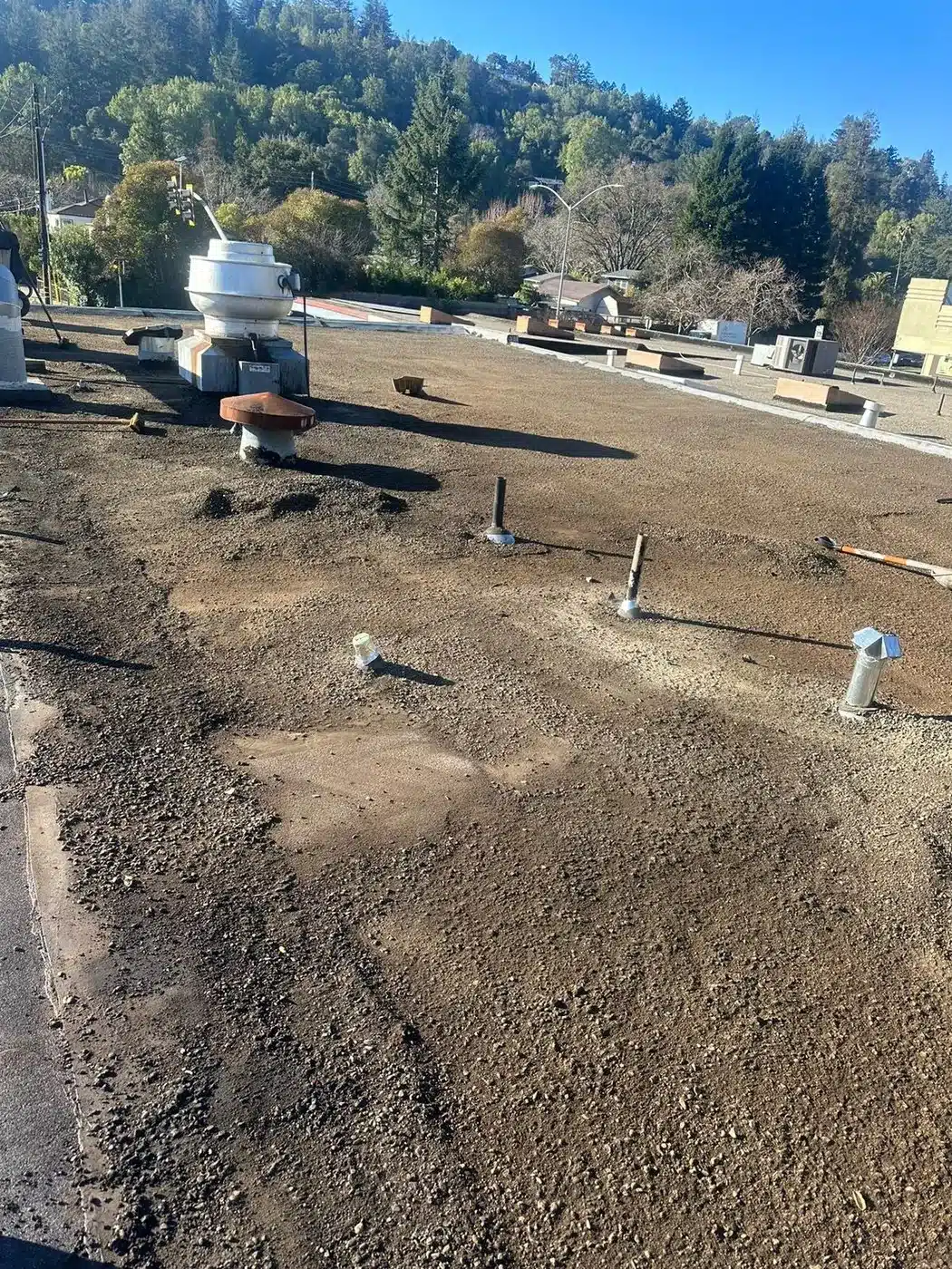 Old gravel scraped from the flat roof during preparation on 4th Street in San Rafael