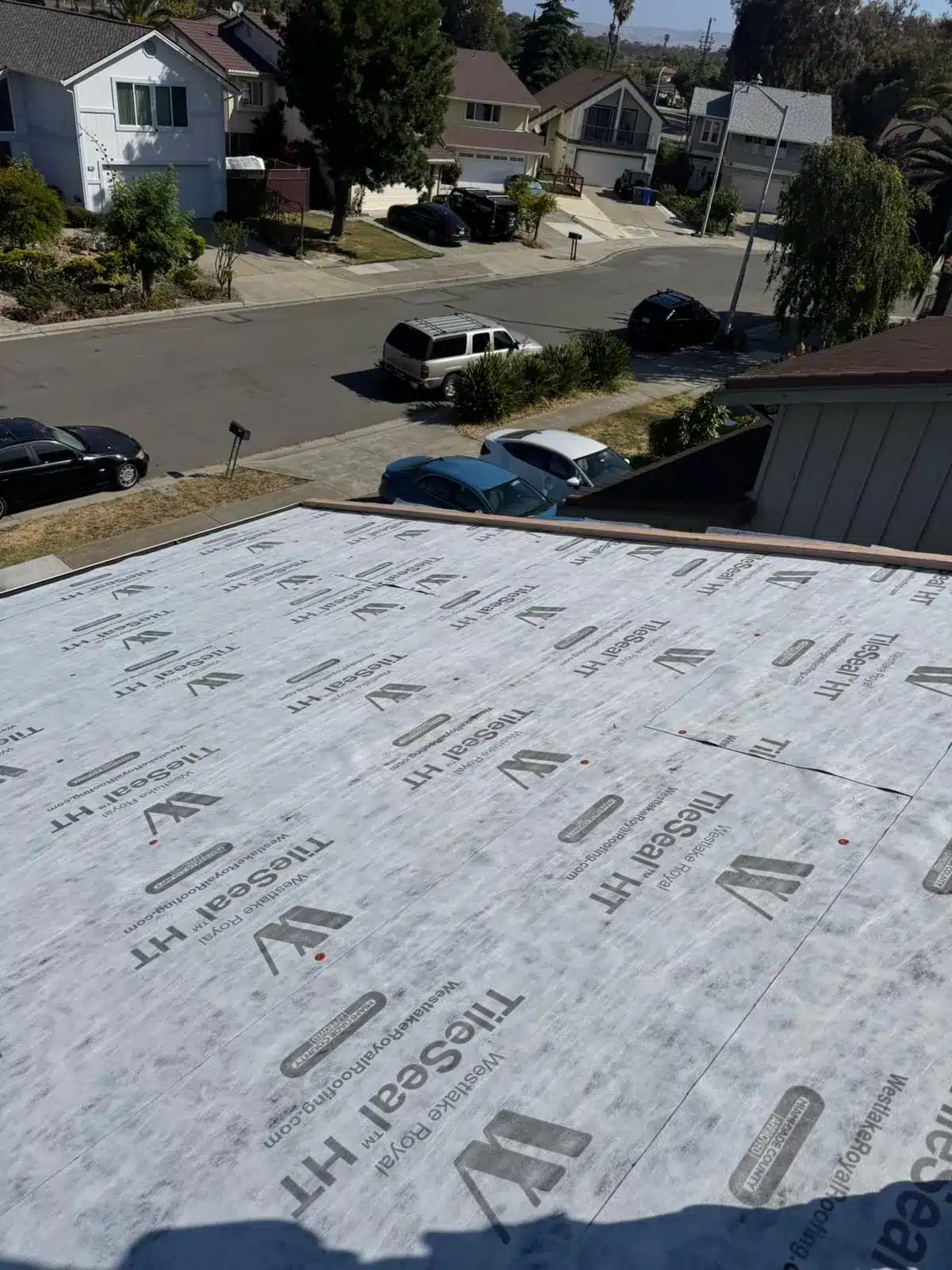 High-temperature underlayment installed over the roof deck before tile loading