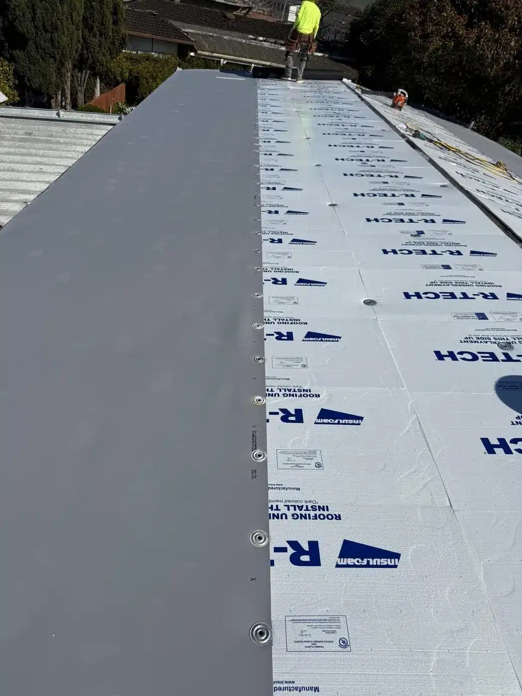R-TECH insulation board and new gray membrane installed over the manufactured-home roof on Berkeley Road in Hayward