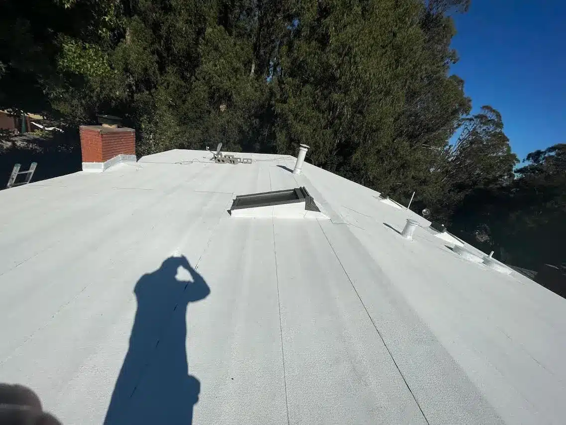 Completed low-slope membrane roof overlooking the bay on Lomita Avenue in Millbrae