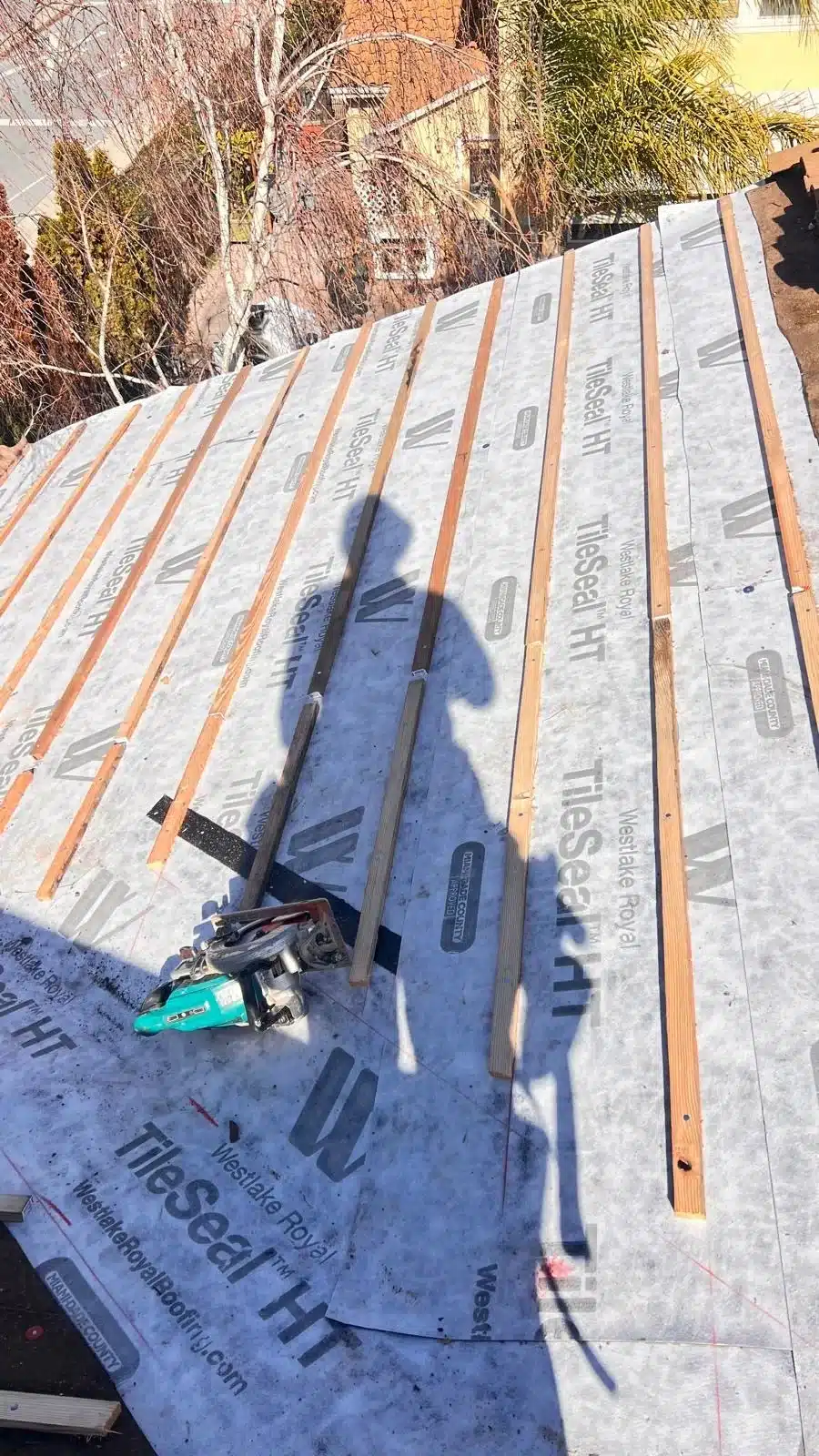New Westlake Royal TileSeal HT underlayment and wood battens installed across a Morgan Hill tile roof plane