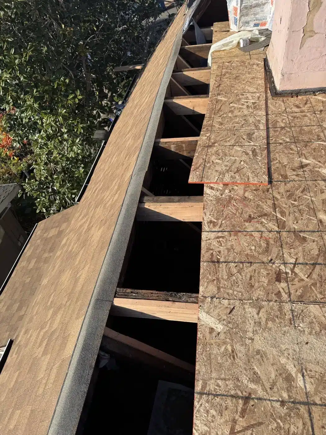 New roof deck panels installed over the rebuilt rafters in Piedmont, CA