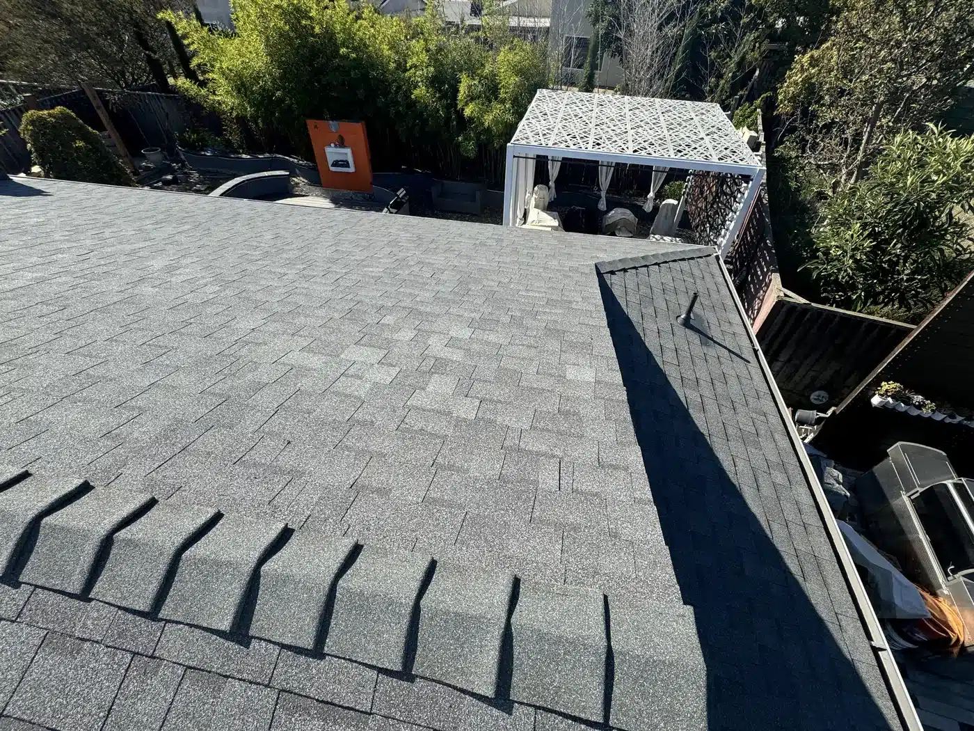 New charcoal architectural shingle roof after replacement on Sylvester Drive in Fremont