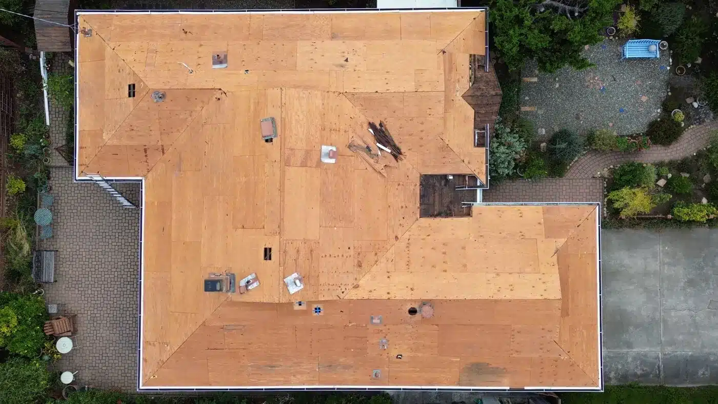 Aerial view of the fully exposed roof deck after tear-off in Mountain View, CA