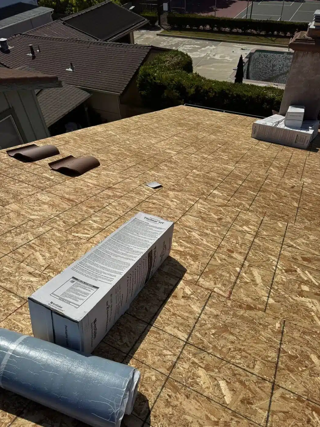 Clean plywood roof deck prepared for a new roof system