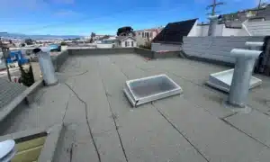 Finished low-slope roof with new cap sheet membrane after replacement in San Francisco