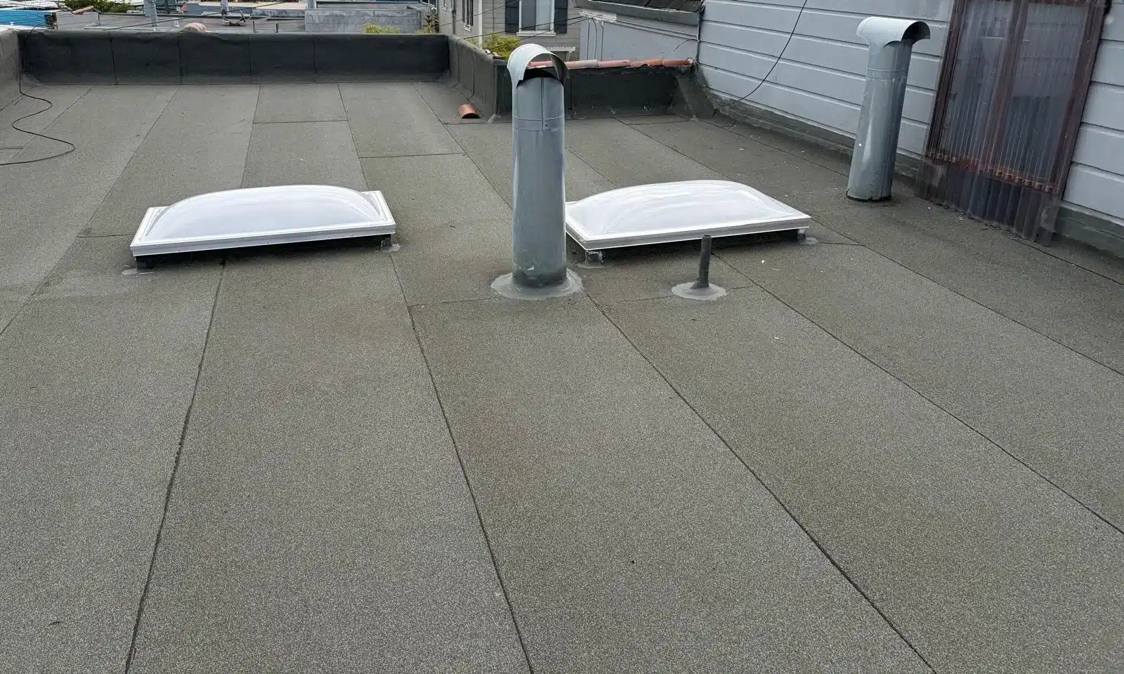 New cap sheet with two new acrylic dome skylights and new vent stacks in San Francisco