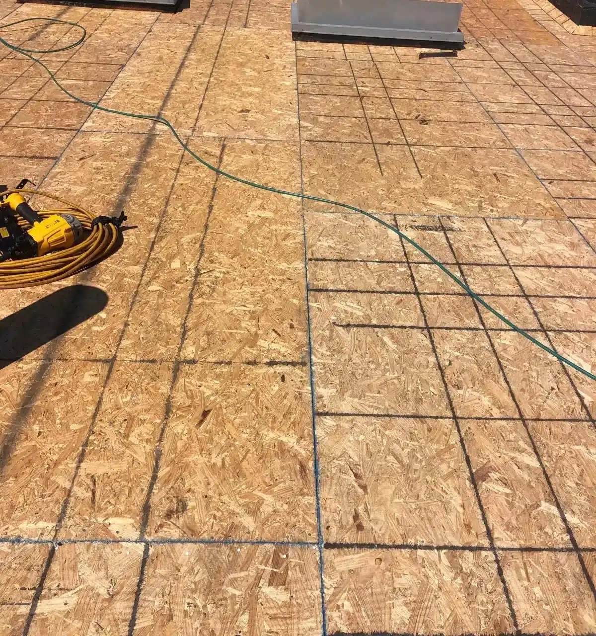 New OSB roof sheathing laid across the whole deck during a San Francisco flat roof replacement
