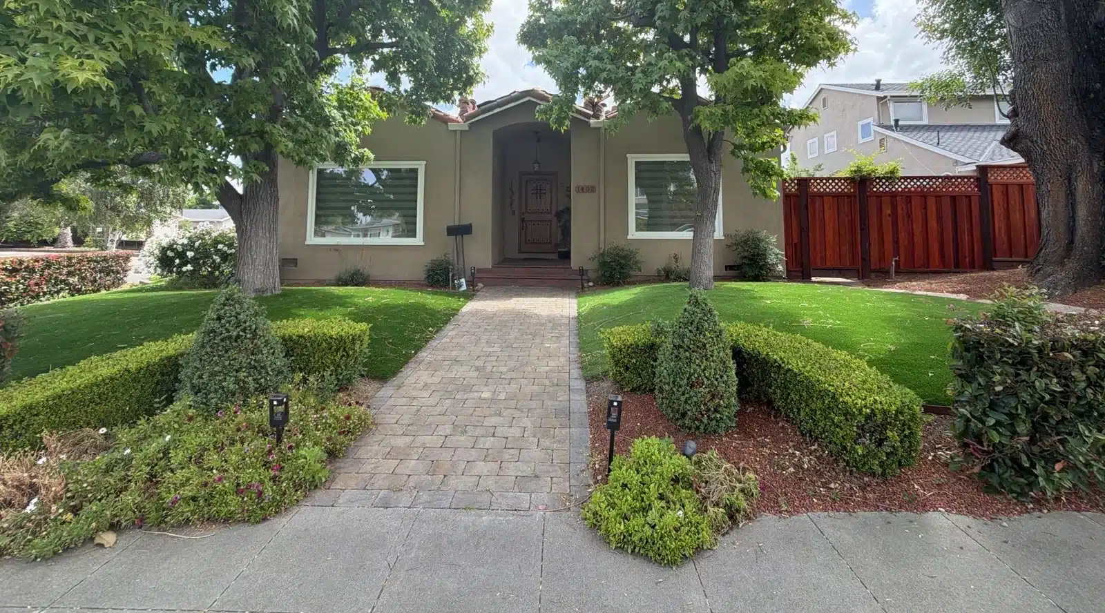 Spanish-style single-storey home with a clay tile roof before work began at 1402 Clarita Avenue, San Jose CA
