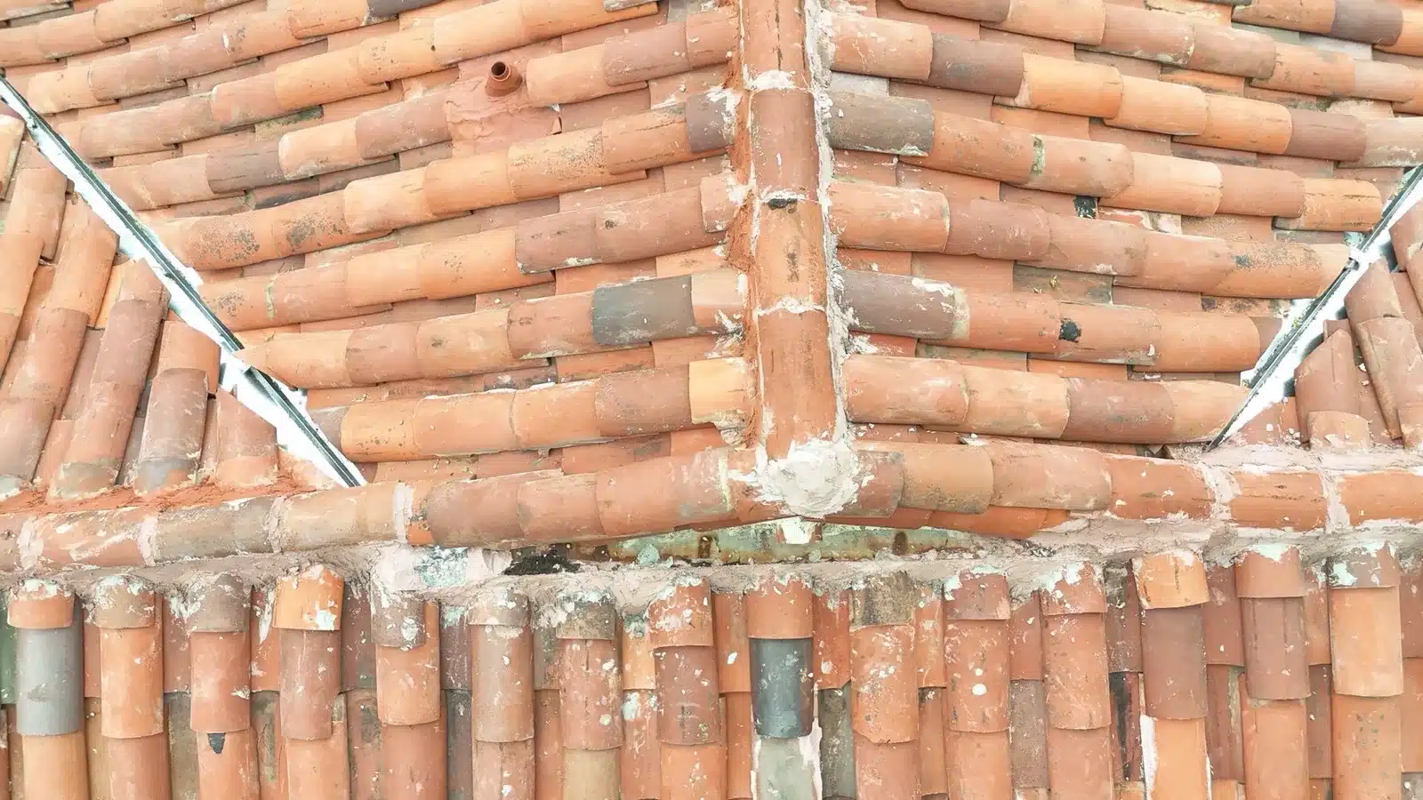 Close view of the two-piece clay barrel tile and mortared hip at 1402 Clarita Avenue, San Jose CA