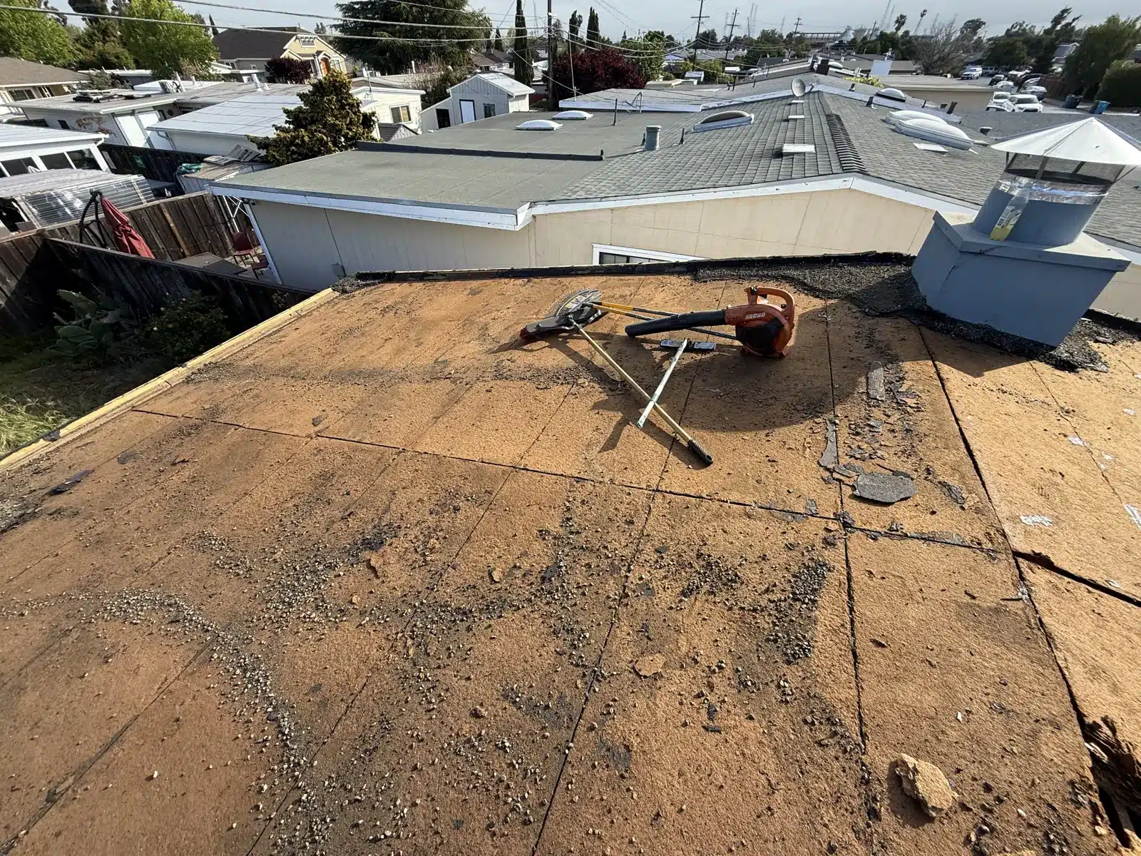 Roof torn off to bare spaced board sheathing during the reroof at Maxine Ave, San Mateo