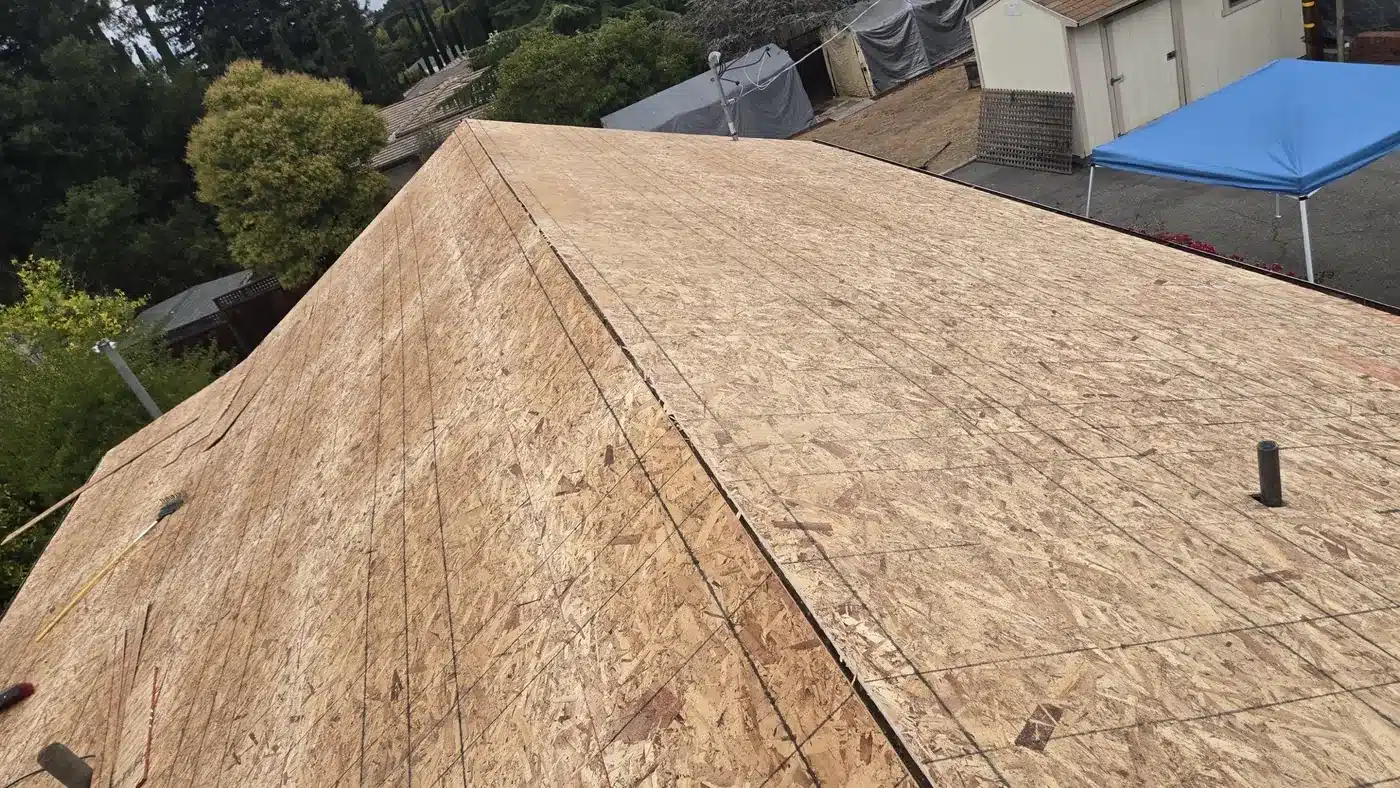 New OSB roof deck installed over skip sheathing during a shake-to-shingle conversion in Saratoga, CA