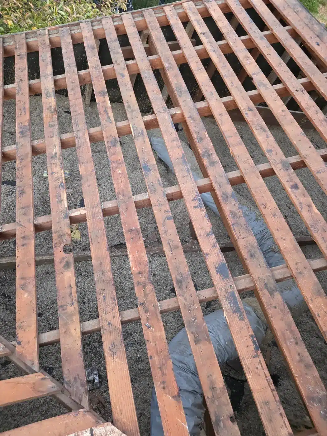 Original skip sheathing exposed after cedar shake tear-off in Palo Alto, CA