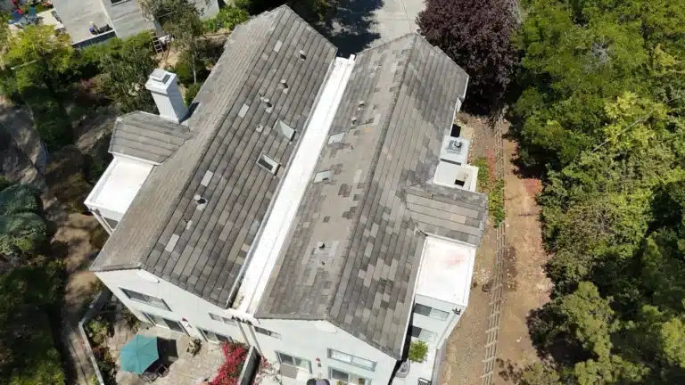 Aerial view of a re-laid concrete tile roof on a townhome building in a Vallejo, CA HOA community