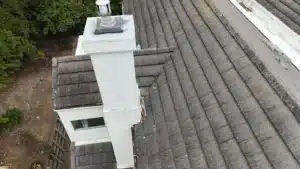Re-laid concrete tile and new flashing at a chimney on a Vallejo townhome