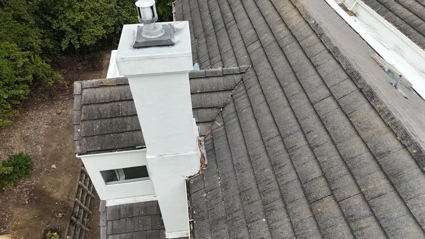 Re-laid concrete tile and new flashing at a chimney on a Vallejo townhome