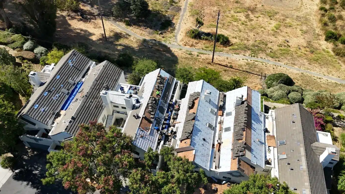 Aerial view of several Vallejo HOA townhome buildings during the community-wide tile roof re-lay