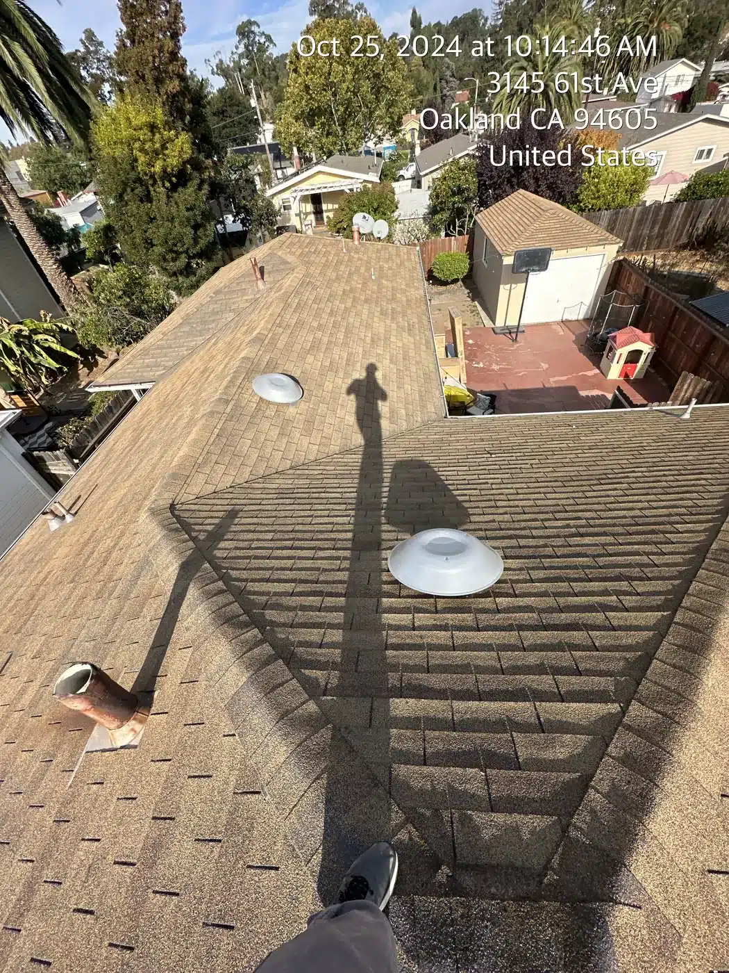 Worn shingle roof with old skylight before replacement on 61st Avenue in East Oakland